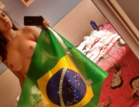 Sexy football fan amateur Betty Boop holding Brazil flag