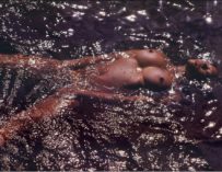 Denise michele floating on her back 3